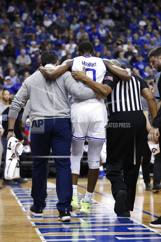 Michael Owens Seton Hall's Quincy McKnight (0) is assisted off of the court after being injured against Xavier's Tyrique Jones during the second half of an NCAA college basketball game, Saturday, feb. 1, 2020, in Newark, N.J. Xavier won, 74-62. (AP Photo/Michael Owens)