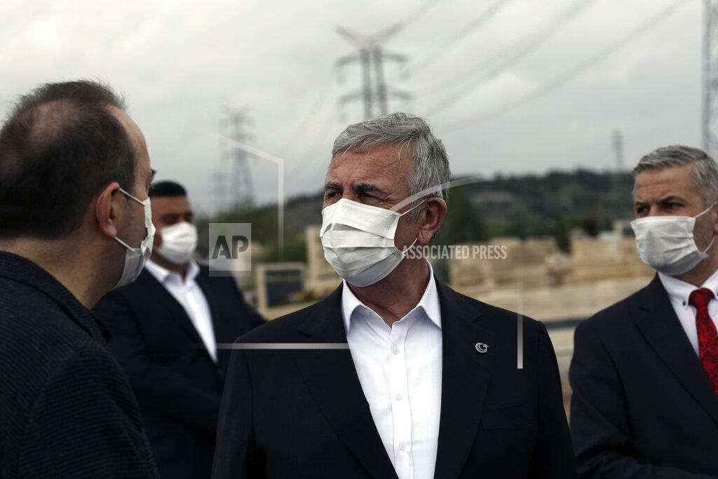 Burhan Ozbilici Ankara Mayor Mansur Yavas, center, and his advisors, wearing masks to help protect against the spread of coronavirus, speak in Ankara, Turkey, Thursday, May 6, 2021. Turkish security forces continue patrolling main streets and set up checkpoints at entry and exits points of cities to enforce Turkey's strictest COVID-19 lockdown to date.(AP Photo/Burhan Ozbilici)
