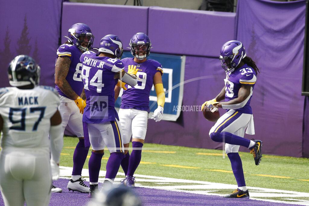 Bruce Kluckhohn Minnesota Vikings running back Dalvin Cook, right, celebrates with teammates after scoring on a 39-yard touchdown run in the first half of an NFL football game against the Tennessee Titans, Sunday, Sept. 27, 2020, in Minneapolis. (AP Photo/Bruce Kluckhohn)
