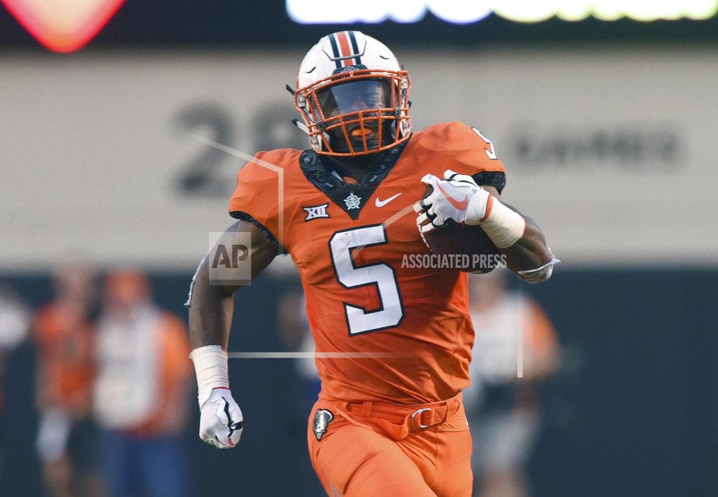 Brody Schmidt FILE - In this Aug. 30, 2018, file photo, Oklahoma State running back Justice Hill runs the ball during a college football game in Stillwater, Okla. Oklahoma State running back Justice Hill will skip his senior season and enter the 2019 NFL draft. Coach Mike Gundy announced Monday, Dec. 3, 2018, that Hill will not play against Missouri in the Liberty Bowl on Dec. 31. Hill made his announcement in a thank you letter to fans, teammates and coaches on social media.(AP Photo/Brody Schmidt, File)