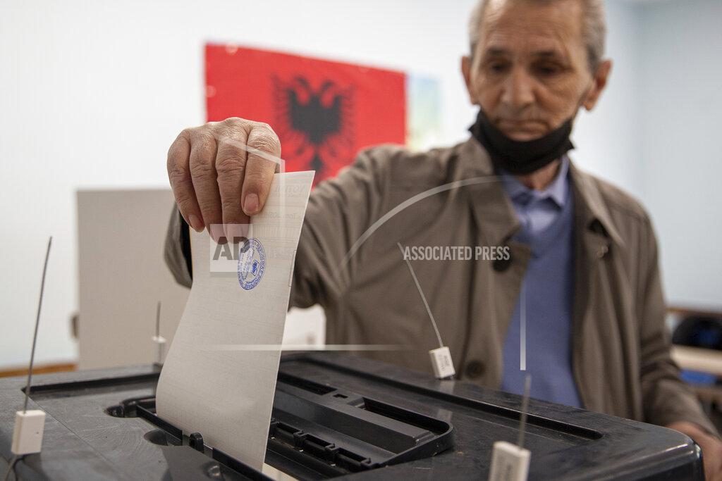 Visar Kryeziu An Albanian man casts his vote during parliamentary elections in capital Tirana, Albania on Sunday, April 25, 2021. Albanian voters have started casting ballots in parliamentary elections on Sunday amid the virus pandemic and a bitter political rivalry between the country's two largest political parties. (AP Photo/Visar Kryeziu)