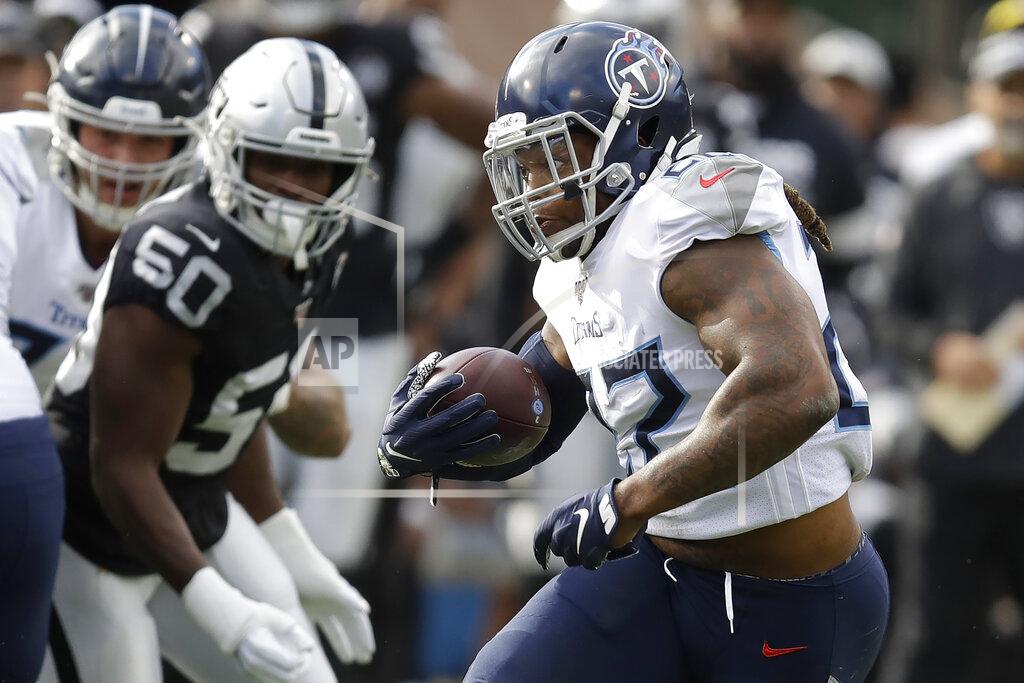 Ben Margot Tennessee Titans running back Derrick Henry, right, runs against the Oakland Raiders during the first half of an NFL football game in Oakland, Calif., Sunday, Dec. 8, 2019. (AP Photo/Ben Margot)