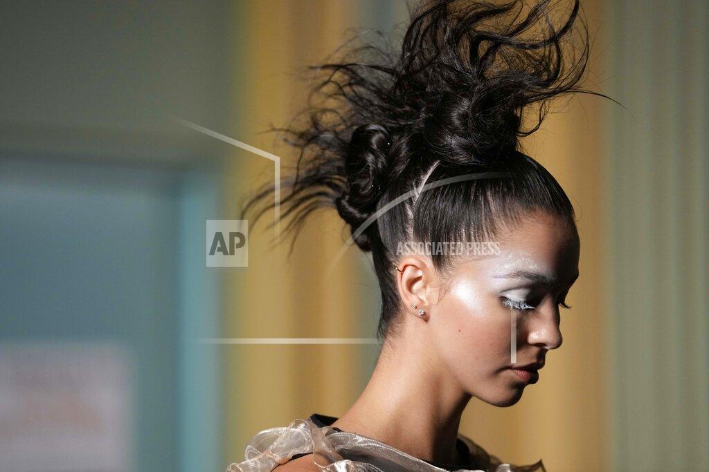 Luca Bruno A model wears a creation of Francesca Liberatore Spring Summer 2022 collection, unveiled during the Milan Fashion Week, in Milan, Italy, Sunday, Sept. 26, 2021. (AP Photo/Luca Bruno)