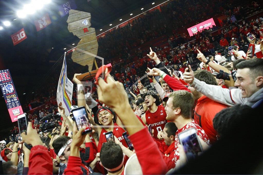 Kathy Willens Rutgers guard Ron Harper Jr. (24) holds the Garden State Hardwood Classic trophy after Rutgers defeated Seton Hall 68-48 in an NCAA college basketball game, Saturday, Dec. 14, 2019, in Piscataway, N.J. (AP Photo/Kathy Willens)