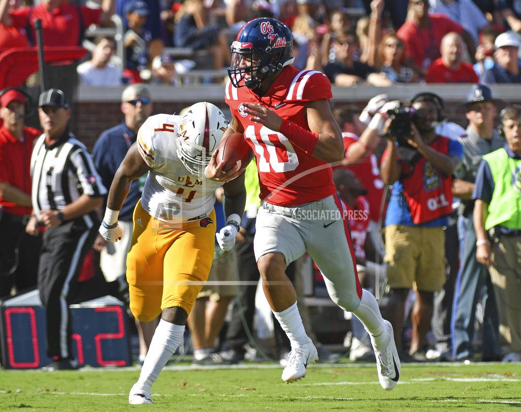 Thomas Graning Mississippi quarterback Jordan Ta'amu (10) carries the ball past Louisiana Monroe linebacker Rashaad Harding (4) for a 39-yard touchdown run during the first half of an NCAA college football game in Oxford, Miss., Saturday, Oct. 6, 2018. (AP Photo/Thomas Graning)