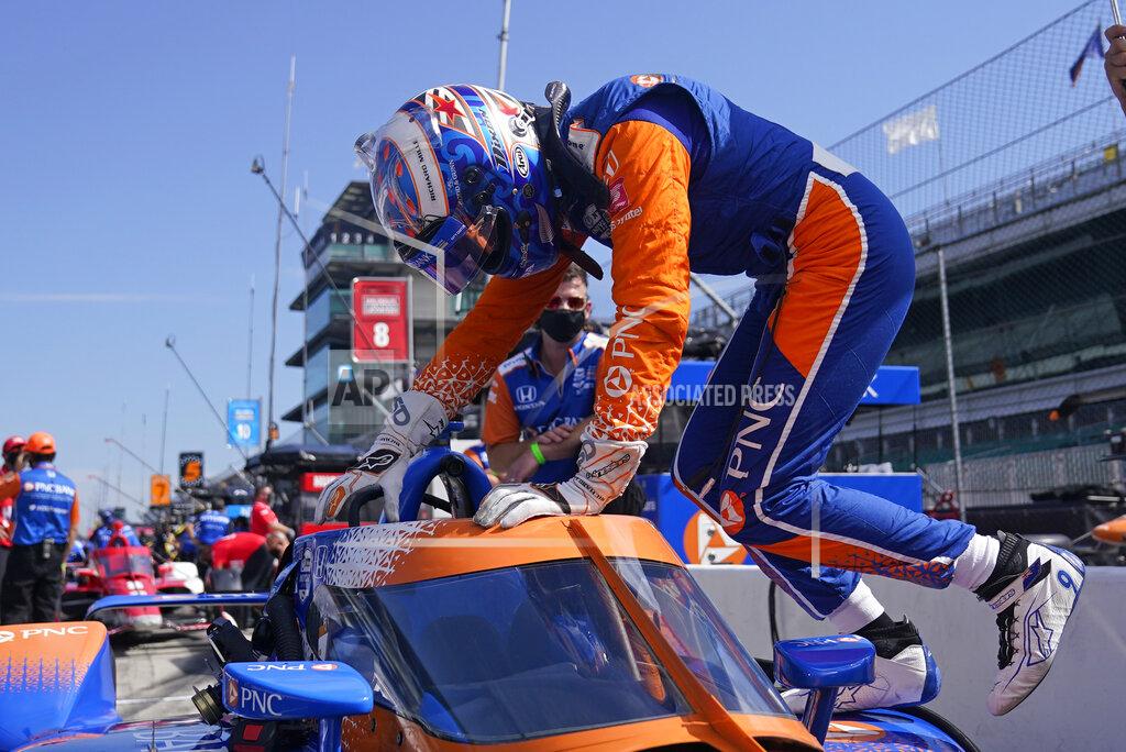 Darron Cummings Scott Dixon, of New Zealand, climbs into his car during a practice session for the Indianapolis 500 auto race at Indianapolis Motor Speedway, Thursday, Aug. 13, 2020, in Indianapolis. (AP Photo/Darron Cummings)