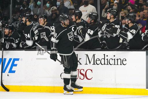Los Angeles Kings' Anze Kopitar, center, celebrates his goal against the Pittsburgh Penguins during the first period of an NHL hockey game Thursday, Jan. 13, 2022, in Los Angeles. (AP Photo/Jae C. Hong)