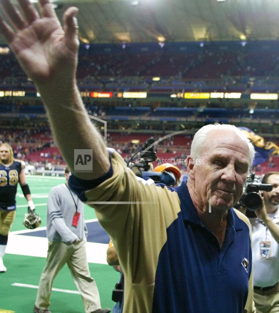 Tom Gannam FILE - In this Dec. 21, 2003, file photo, St. Louis Rams defensive line coach Jim Hanifan waives goodbye to the crowd after the team's NFL football game against the Cincinnati Bengals in St. Louis. Hanifan retired after 31 years of coaching in the league. Hanifan, the former St. Louis Cardinals coach who returned to the city as offensive line coach to help the Rams win the Super Bowl, has died. He was 87. Hanifan’s daughter, Kathy Hinder, told the St. Louis Post-Dispatch that he died Tuesday, Nov. 24, 2020. She said the cause of death hasn't been determined, but said it wasn't related to COVID-19. (AP Photo/Tom Gannam, File)