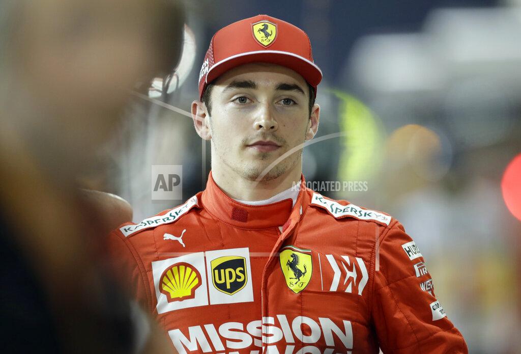 Luca Bruno Ferrari driver Charles Leclerc of Monaco celebrates his pole position after the qualifying session at the Formula One Bahrain International Circuit in Sakhir, Bahrain, Saturday, March 30, 2019. The Bahrain Formula One Grand Prix will take place on Sunday. (AP Photo/Luca Bruno)