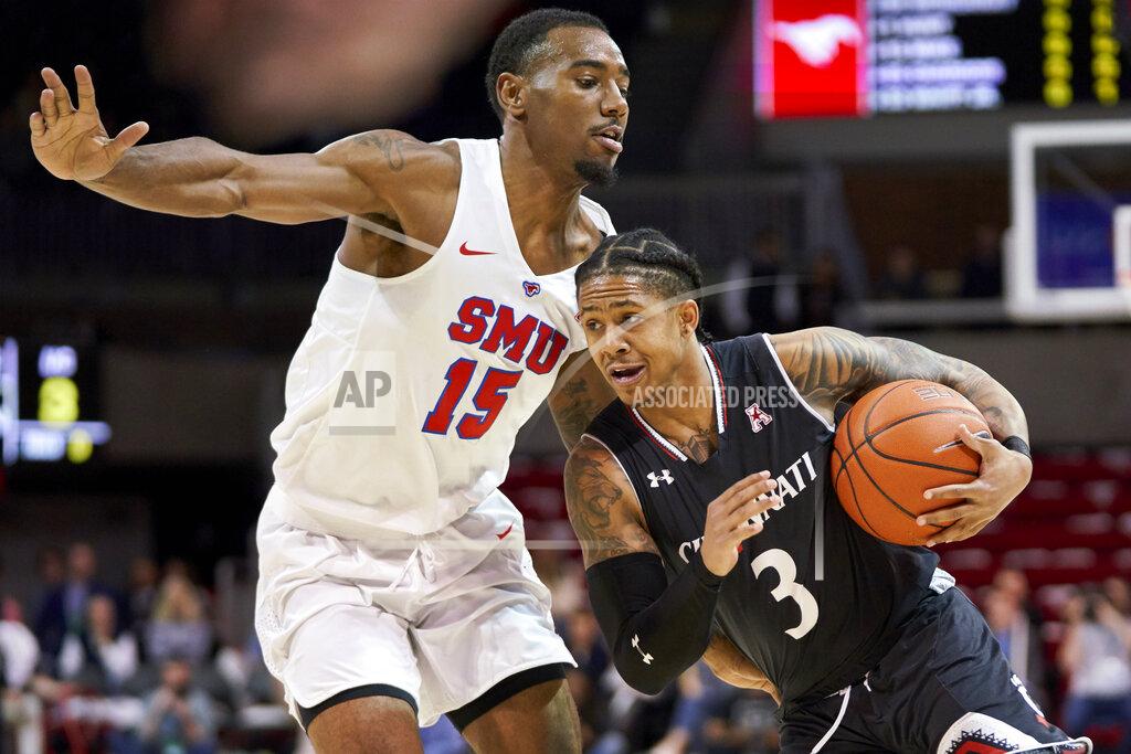 Cooper Neill Cincinnati guard Justin Jenifer (3) drives to the basket against SMU's Isiaha Mike (15) during the first half of an NCAA college basketball game at Moody Coliseum, Wednesday, Feb. 27, 2019, in Dallas. (AP Photo/Cooper Neill)