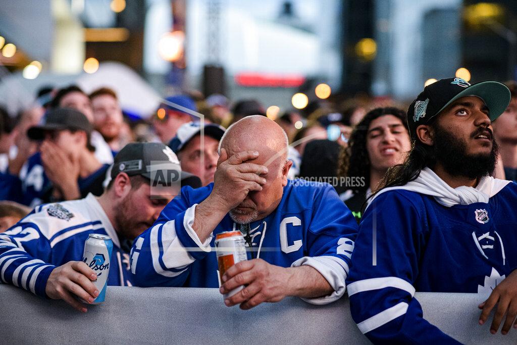 Christopher Katsarov Fans react during Game 7 of an NHL hockey first-round playoff series between the Toronto Maple Leafs and the Tampa Bay Lightning in Toronto, Saturday May 14, 2022. (Christopher Katsarov/The Canadian Press via AP)
