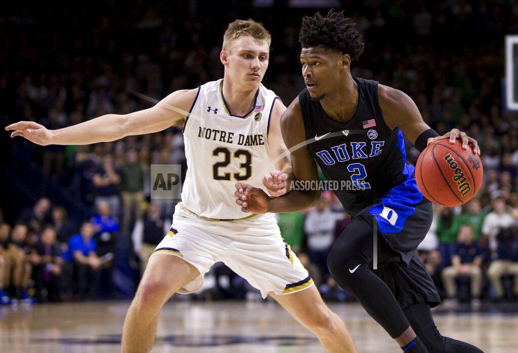 Robert Franklin Duke's Cam Reddish (2) drives by Notre Dame's Dane Goodwin (23) during the first half of an NCAA college basketball game Monday, Jan. 28, 2019, in South Bend, Ind. (AP Photo/Robert Franklin)