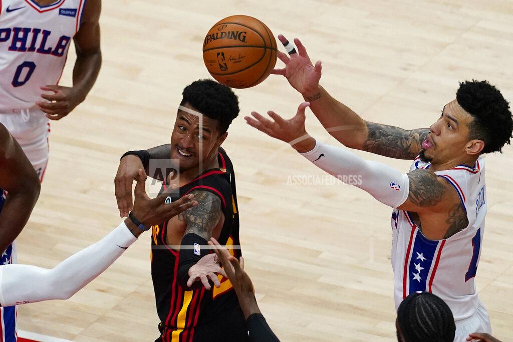 John Bazemore Atlanta Hawks forward John Collins (20) and Philadelphia 76ers forward Danny Green (14) battle for a rebound during the first half of an NBA basketball game Monday, Jan. 11, 2021, in Atlanta. (AP Photo/John Bazemore)