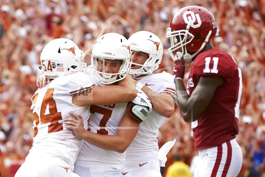 Cooper Neill FILE - In this Saturday, Oct. 6, 2018, file photo, Texas kicker Cameron Dicker (17) celebrates with teammates after kicking the game-winning field goal in the closing seconds of the second half of an NCAA college football game against Oklahoma at the Cotton Bowl in Dallas. Dicker shook off a few misses from the previous two games to deliver when Texas needed it most. (AP Photo/Cooper Neill, File)