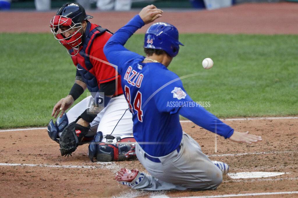 Tony Dejak Chicago Cubs' Anthony Rizzo, right, scores as Cleveland Indians catcher Sandy Leon can't hold onto the ball in the fifth inning in a baseball game, Wednesday, Aug. 12, 2020, in Cleveland. (AP Photo/Tony Dejak)