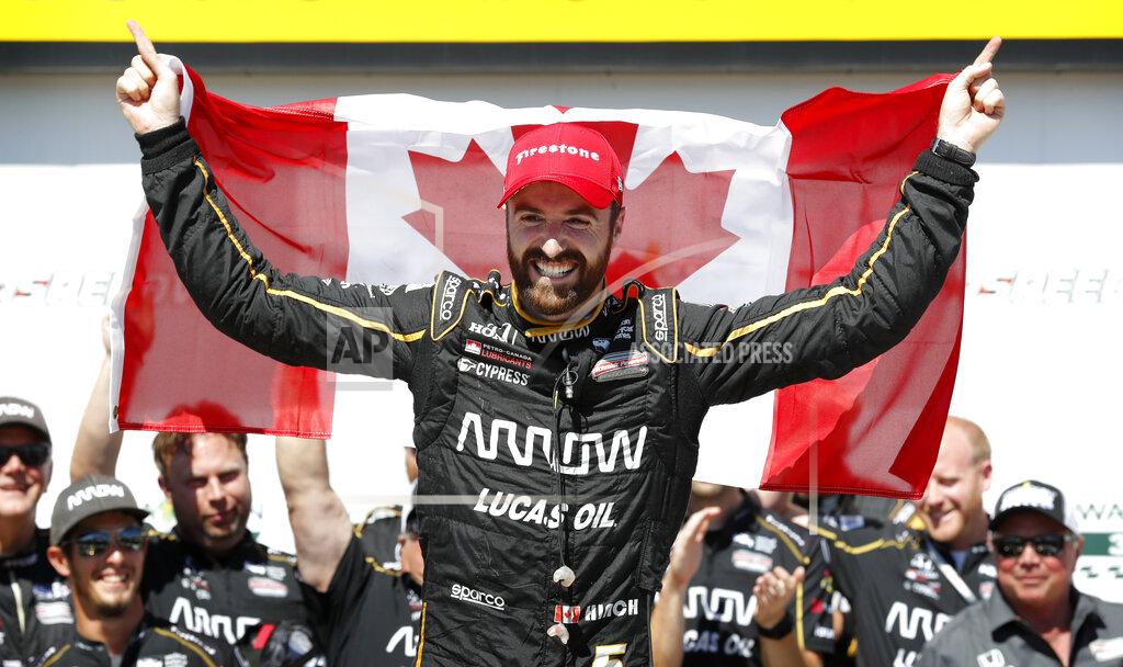 Charlie Neibergall FILE - In this July 8, 2018, file photo, James Hinchcliffe celebrates after winning an IndyCar Series auto race at Iowa Speedway in Newton, Iowa. Hinchcliffe will return to Andretti Autosport for three races this season, including the Indianapolis 500. (AP Photo/Charlie Neibergall, File)