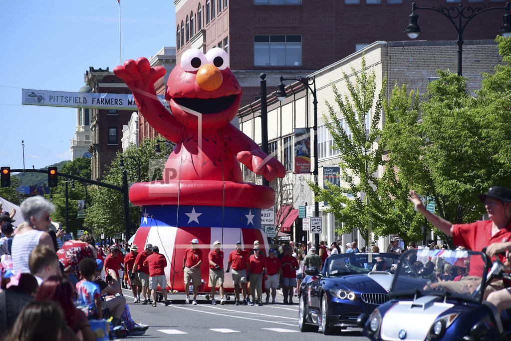 Gillian L. Jones Sesame Street's Elmo float is carried through the Pittsfield Fourth of July parade in Pittsfield, Mass., on Monday, July, 4, 2022. (Gillian L. Jones/The Berkshire Eagle via AP)