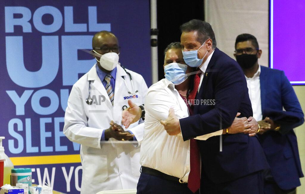 Mike Segar Gov. Andrew Cuomo embraces Radhames Rodriguez, President of United Bodegas of America, after Rodriguez received a Pfizer COVID-19 vaccination shot at an event to announce five new walk-in pop-up COVID-19 vaccination sites for New York Bodega, grocery store and supermarket workers in the Harlem section of New York on Friday, April 23, 2021. (Mike Segar/Pool Photo via AP)