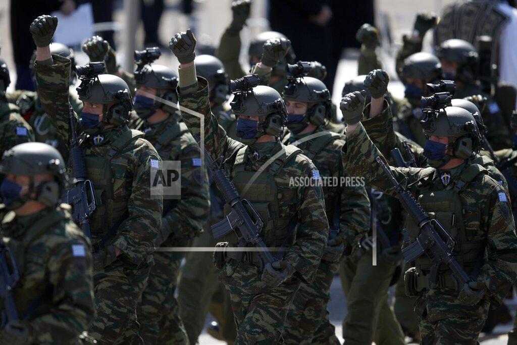 Thanassis Stavrakis Members of the Greek Army parade in front of the Greek Parliament in Athens, Thursday, March 25, 2021. Greece's celebrations for the bicentenary of the start of the nation's war of independence are culminating in a military parade and warplane flyby in Athens on Thursday, the country's Independence Day. (AP Photo/Thanassis Stavrakis)
