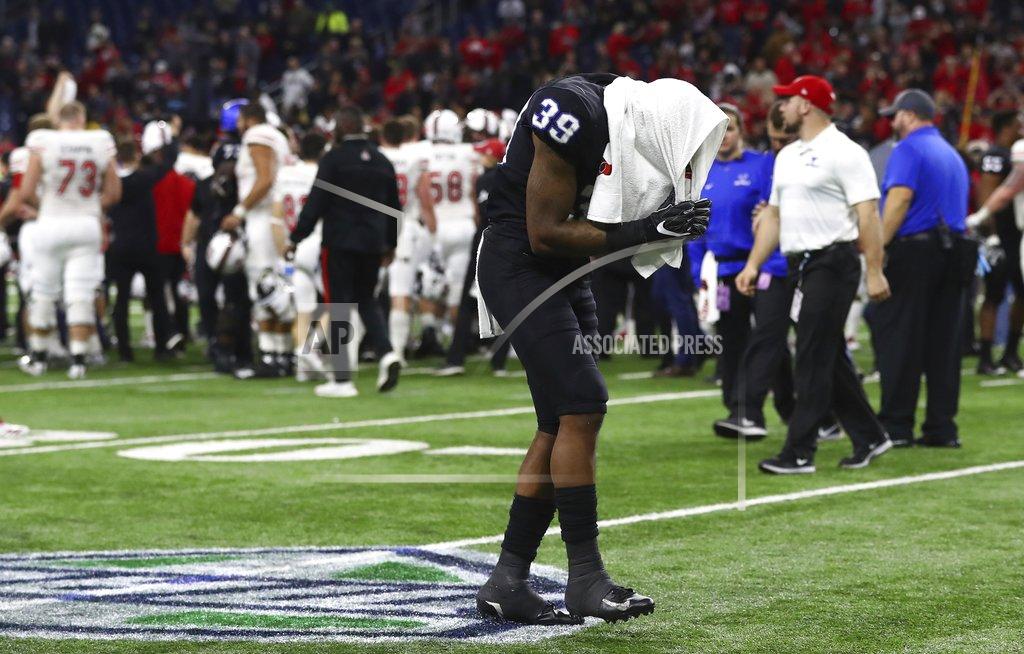 Carlos Osorio Buffalo cornerback Cameron Lewis (39) walks off the field after the Mid-American Conference championship NCAA college football game against Northern Illinois, Friday, Nov. 30, 2018, in Detroit. (AP Photo/Carlos Osorio)