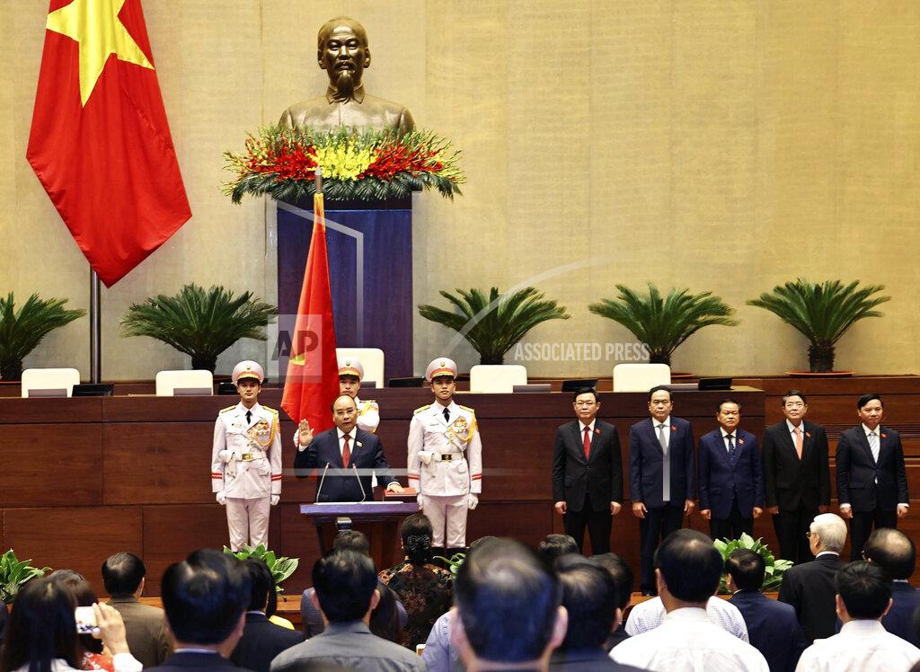 Nguyen Trong Duc Vietnamese newly elected President Nguyen Xuan Phuc takes an oath in front of the National Assembly in Hanoi, Vietnam on Monday, April 5, 2021. Vietnam's legislature voted Monday to make Pham Minh Chinh, a member of the Communist party's central committee for personnel and organization, the country's next prime minister. Outgoing Prime Minister Nguyen Xuan Phuc was appointed the new president. (Nguyen Trong Duc/ VNA via AP)