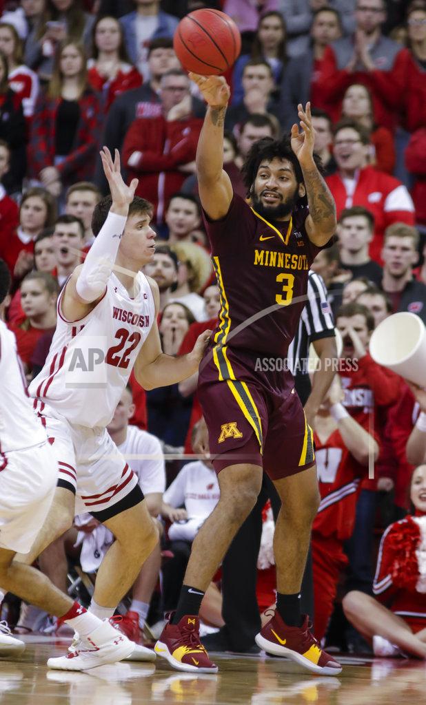 Andy Manis Minnesota's Jordan Murphy (3) passes the ball as Wisconsin's Ethan Happ (22) defends during the second half of an NCAA college basketball game Thursday, Jan. 3, 2019, in Madison, Wis. Minnesota won 59-52. (AP Photo/Andy Manis)