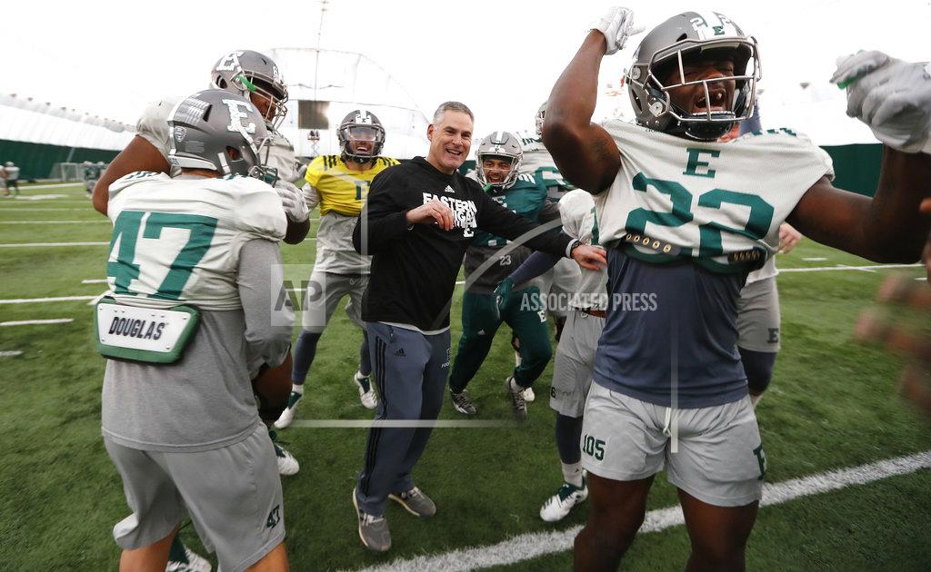Paul Sancya Eastern Michigan football coach Chris Creighton reacts with players during a drill in Ypsilanti, Mich., Monday, Dec. 10, 2018. Eastern Michigan's football team has stepped out of the shadows created by the neighboring University of Michigan and four professional teams just down the road in the Motor City. The Eagles will face Georgia Southern in the Camellia Bowl on Saturday, earning a spot in NCAA football postseason play for the second time in three years and just the third time in school history. (AP Photo/Paul Sancya)