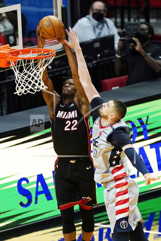 Marta Lavandier Miami Heat forward Jimmy Butler (22) dunks the ball as Washington Wizards center Alex Len (27) defends during the first half of an NBA basketball game, Friday, Feb. 5, 2021, in Miami. (AP Photo/Marta Lavandier)