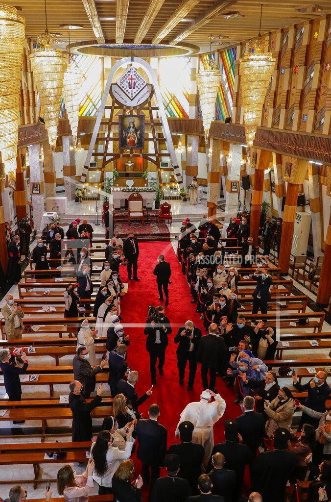 Andrew Medichini Pope Francis arrives for a meeting with bishops and priests, at the Sayidat al-Nejat (Our Lady of Salvation) Cathedral, in Baghdad, Iraq, Friday, March 5, 2021. Pope Francis has arrived in Iraq to urge the country's dwindling number of Christians to stay put and help rebuild the country after years of war and persecution, brushing aside the coronavirus pandemic and security concerns. (AP Photo/Andrew Medichini)