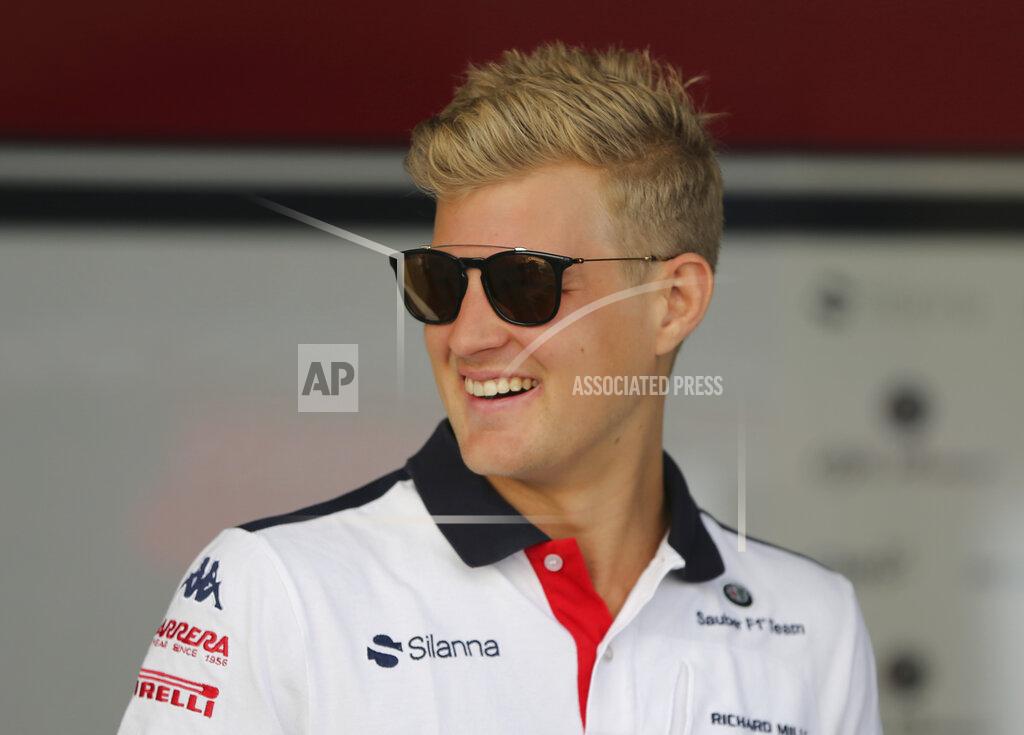 Kamran Jebreili File-This Nov. 22, 2018, file photo shows Sauber driver Marcus Ericsson of Sweden arriving at the Yas Marina racetrack in Abu Dhabi, United Arab Emirates. After their early years racing each other in karts, Sweden’s Ericsson and Felix Rosenqvist took very different paths chasing checkered flags around the globe before finally landing in the U.S. Now they represent a “Swedish Invasion” of IndyCar as two series rookies with vast experience and big expectations heading into the 2019 season. (AP Photo/Kamran Jebreili, File)
