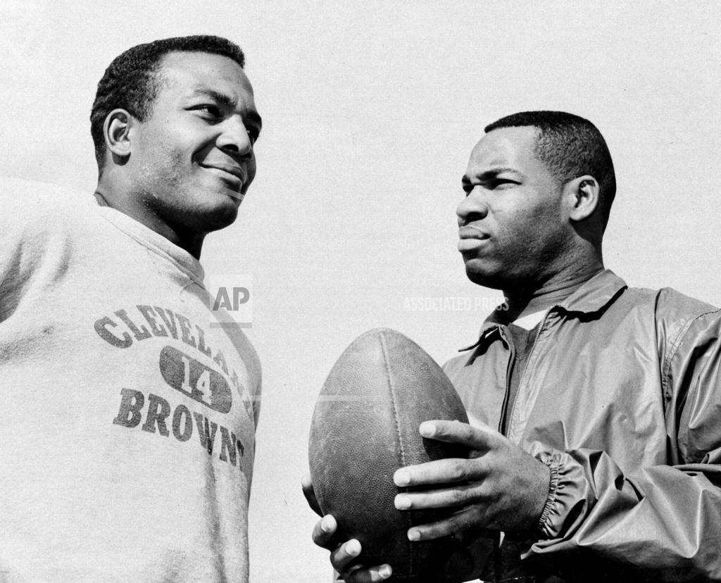 Harold Filan FILE - In this Jan. 11, 1964, file photo, fullback Jim Brown, left, and flanker back Bobby Mitchell, once a feared duo for the Cleveland Browns before Mitchell was dealt to Washington, are back together as teammates, as they prepare for the annual Pro Bowl at Los Angeles. Mitchell, the speedy late 1950s and ’60s NFL offensive star the Browns and the Washington Redskins, has died. He was 84. The Pro Football Hall of Fame said Sunday night, April 5, 2020, that Mitchell’s family said he died in the afternoon. (AP Photo/Harold Filan, File)