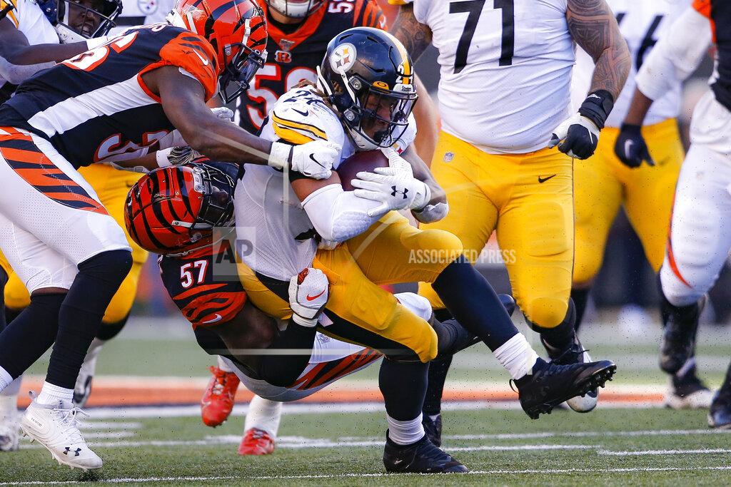Gary Landers Pittsburgh Steelers running back Benny Snell (24) is tackled on the run by Cincinnati Bengals linebacker Germaine Pratt (57) during the second half an NFL football game, Sunday, Nov. 24, 2019, in Cincinnati. (AP Photo/Gary Landers)