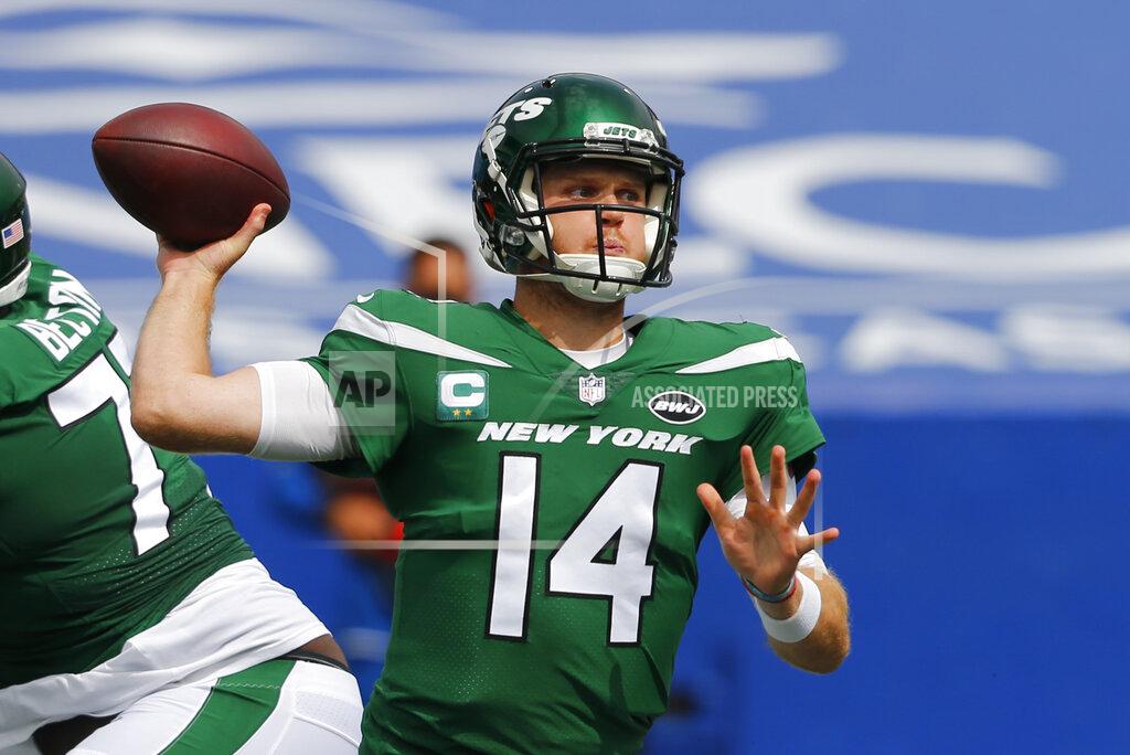 New York Jets quarterback Sam Darnold (14) throws a pass during the first half of an NFL football game against the Buffalo Bills in Orchard Park, N.Y., Sunday, Sept. 13, 2020. (AP Photo/Jeffrey T. Barnes)