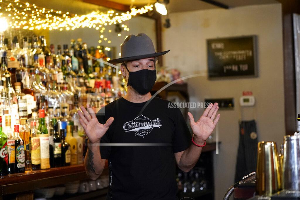 David J. Phillip Michael Neff, co-owner of the Cottonmouth Club, talks about the spread of COVID-19 Tuesday, June 23, 2020, in Houston. Neff closed his downtown bar because of concerns within the industry as number COVID-19 case continues to rise in Houston. (AP Photo/David J. Phillip)