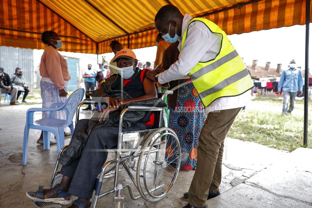 Brian Inganga A Kenyan man receives a dose of the AstraZeneca coronavirus vaccine donated by Britain, at the Makongeni Estate in Nairobi, Kenya Saturday, Aug. 14, 2021. In late June, the international system for sharing coronavirus vaccines sent about 530,000 doses to Britain – more than double the amount sent that month to the entire continent of Africa. It was the latest example of how a system that was supposed to guarantee low and middle-income countries vaccines is failing, leaving them at the mercy of haphazard donations from rich countries. (AP Photo/Brian Inganga)