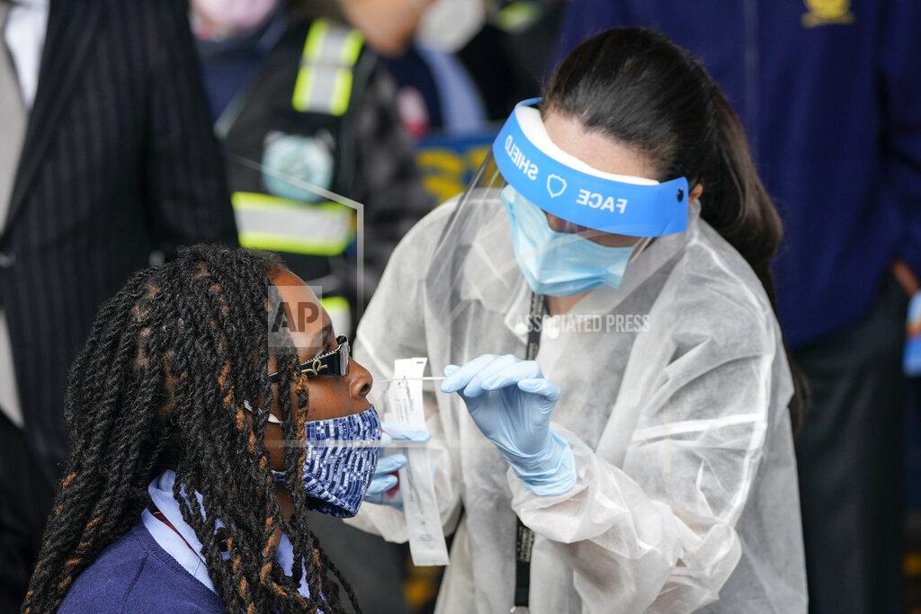 Frank Franklin Ii Bus Operator, Cathy Davis-Baker, gets a Covid test as part of an initiative by the Metropolitan Transportation Authority to test its workers Tuesday, Oct. 27, 2020, at the Grand Avenue Bus Depot in New York. (AP Photo/Frank Franklin II)