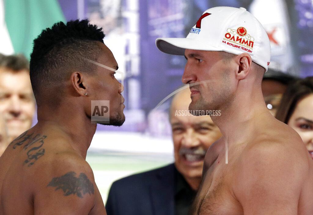 Tony Gutierrez Eleider Alvarez, left, the WBO light heavyweight champion, and Sergey Kovalev, right, pose for photos after their weigh-ins in Frisco, Texas, Friday, Feb. 1, 2019. The two are scheduled to fight for the title Saturday. (AP Photo/Tony Gutierrez)