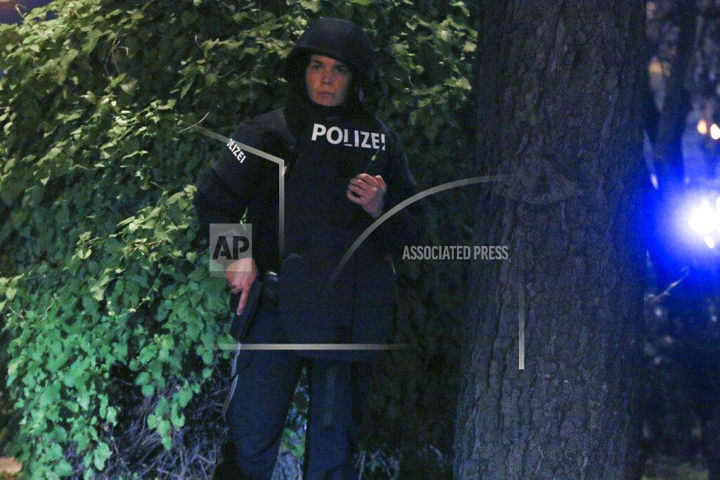 Ronald Zak A police officer stay in position at the scene after gunshots were heard, in Vienna, Monday, Nov. 2, 2020. Austrian police say several people have been injured and officers are out in force following gunfire in the capital Vienna. Initial reports that a synagogue was the target of an attack couldn't immediately be confirmed. Austrian news agency APA quoted the country's Interior Ministry saying one attacker has been killed and another could be on the run.(Photo/Ronald Zak)