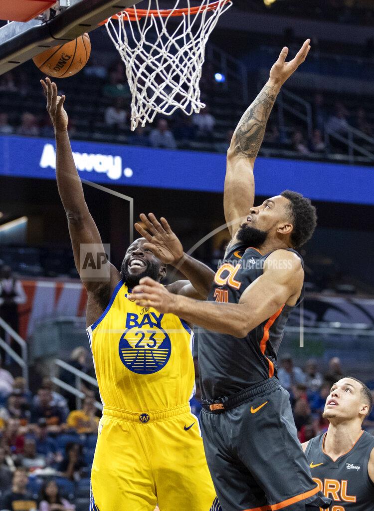 Willie J. Allen Jr. Golden State Warriors forward Draymond Green (23) lays the ball up on Orlando Magic center Khem Birch (24) during the first half of an NBA basketball game, Sunday, Dec. 1, 2019, in Orlando, Fla. (AP Photo/Willie J. Allen Jr.)