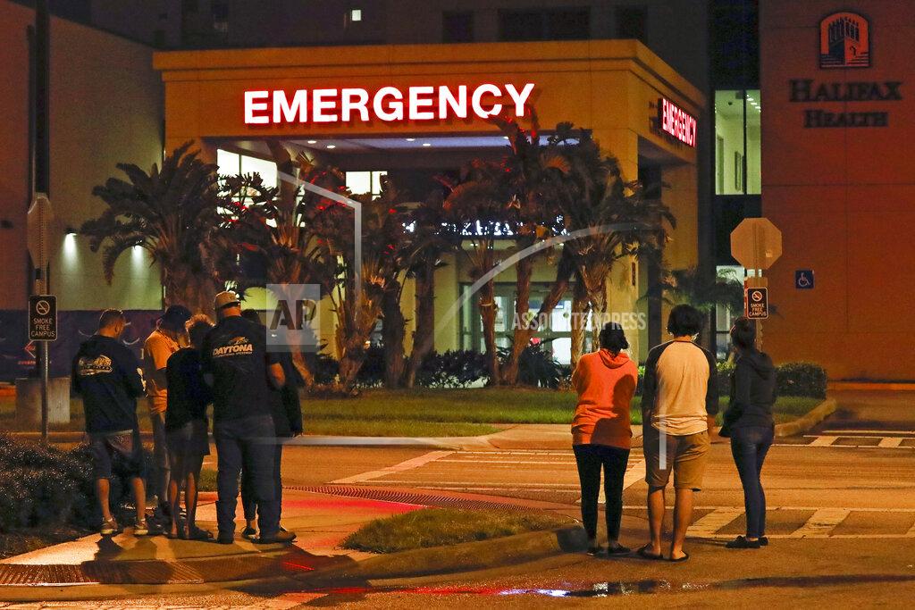 Terry Renna Race fans wait outside the emergency room of Halifax Health Medical Center where Ryan Newman was taken after he was involved in a crash during the final lap of the NASCAR Daytona 500 auto race at Daytona International Speedway, Monday, Feb. 17, 2020, in Daytona Beach, Fla. (AP Photo/Terry Renna)