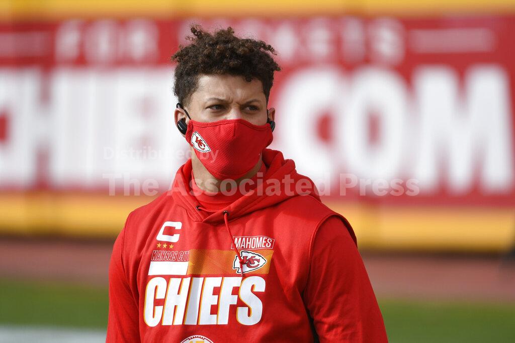 Kansas City Chiefs quarterback Patrick Mahomes walks on the field before an NFL divisional round football game against the Cleveland Browns, Sunday, Jan. 17, 2021, in Kansas City. (AP Photo/Reed Hoffmann)