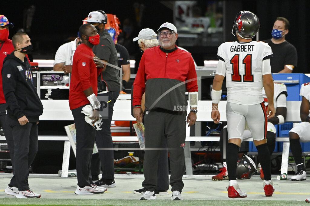 David Becker Tampa Bay Buccaneers head coach Bruce Arians smiles form the sidlines during the second half of an NFL football game against the Las Vegas Raiders, Sunday, Oct. 25, 2020, in Las Vegas. (AP Photo/David Becker)
