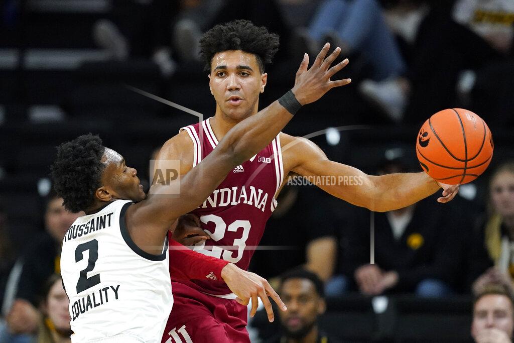 Charlie Neibergall Indiana forward Trayce Jackson-Davis (23) passes around Iowa guard Joe Toussaint (2) during the second half of an NCAA college basketball game, Thursday, Jan. 13, 2022, in Iowa City, Iowa. (AP Photo/Charlie Neibergall)