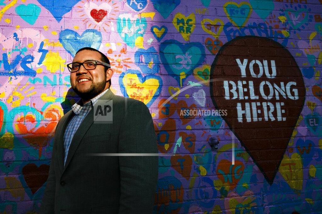 Jacquelyn Martin FILE - In this Tuesday, March 10, 2020 file photo, Ricky Hurtado, the first Latino candidate to run for North Carolina's House of Representatives, poses for a portrait by a mural in Graham, N.C. It's been a tumultuous few months for Hurtado. In November, the 32-year-old son of Salvadoran immigrant won a seat in the North Carolina state legislature as a Democrat representing a suburban slice of Alamance County. (AP Photo/Jacquelyn Martin)
