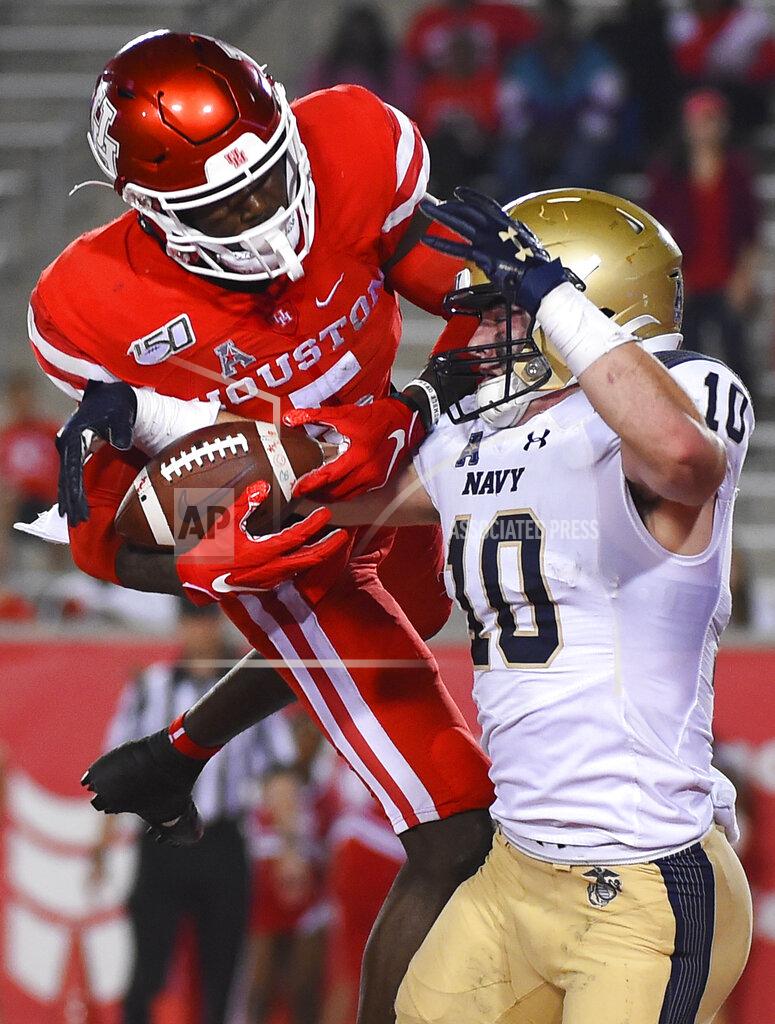 Eric Christian Smith Navy safety Kevin Brennan (10) intercepts a pass n the end zone intended for Houston wide receiver Marquez Stevenson during the second half of an NCAA college football game, Saturday, Nov. 30, 2019, in Houston. (AP Photo/Eric Christian Smith)