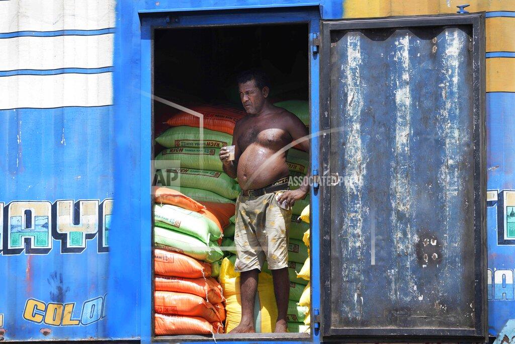 Eranga Jayawardena A labourer stands in a lorry at a wholesale market in Colombo, Sri Lanka, Thursday, May 26, 2022. Sri Lankans for months have been forced to stand in long lines to buy scarce essentials, with many returning home empty-handed. There is a severe shortage of many goods, from food, cooking gas, medicine and fuel to toilet paper and matchsticks.(AP Photo/Eranga Jayawardena)