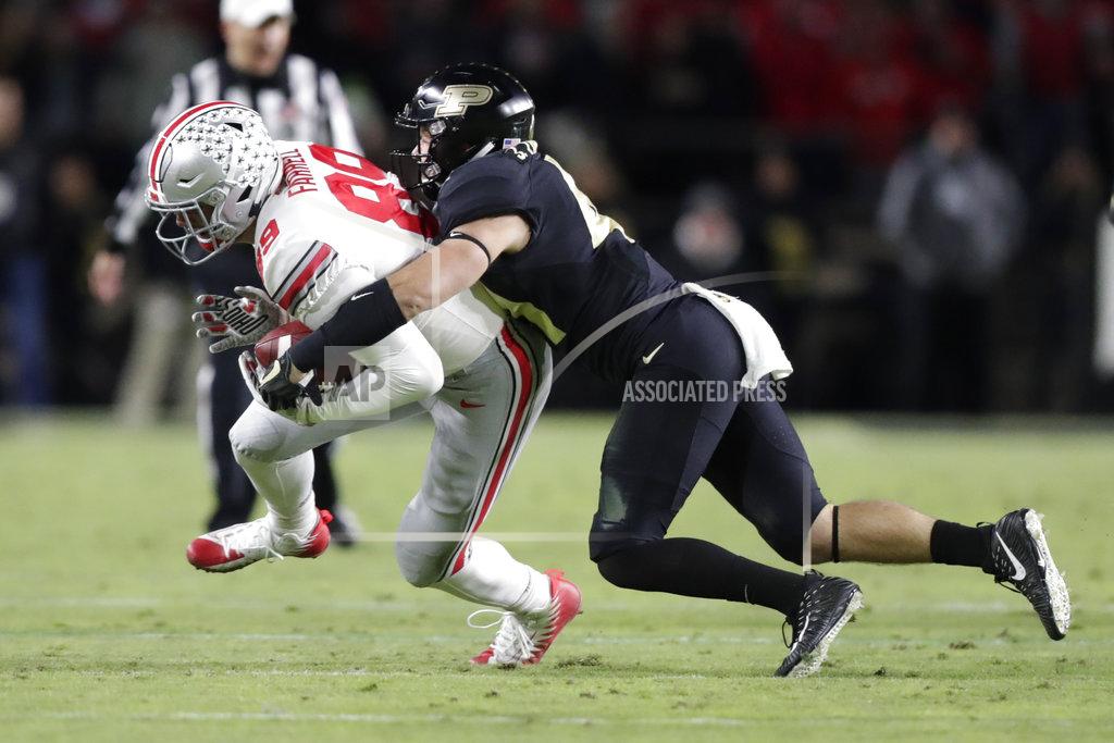 Michael Conroy Purdue safety Jacob Thieneman (41) tackles Ohio State tight end Luke Farrell (89) during the first half of an NCAA college football game in West Lafayette, Ind., Saturday, Oct. 20, 2018. (AP Photo/Michael Conroy)