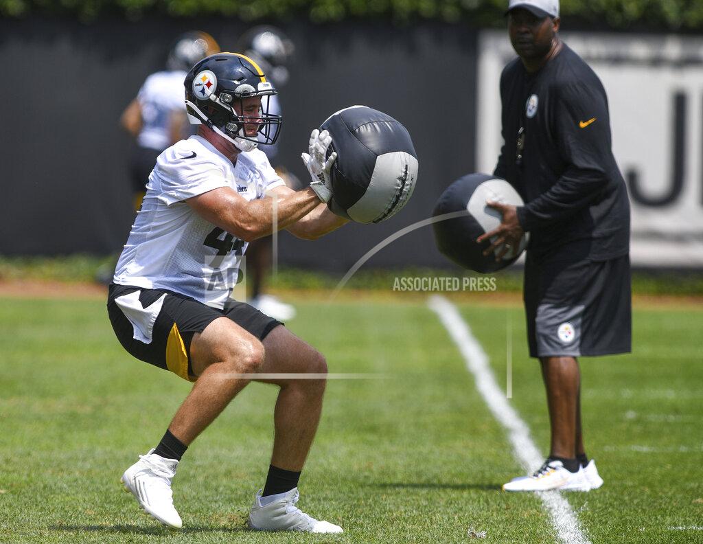 Steve Mellon Pittsburgh Steelers fullback Derek Watt bats away a weighted ball during the NFL football team's training camp in Pittsburgh on Friday, July 23, 2021. (Steve Mellon/Pittsburgh Post-Gazette via AP)