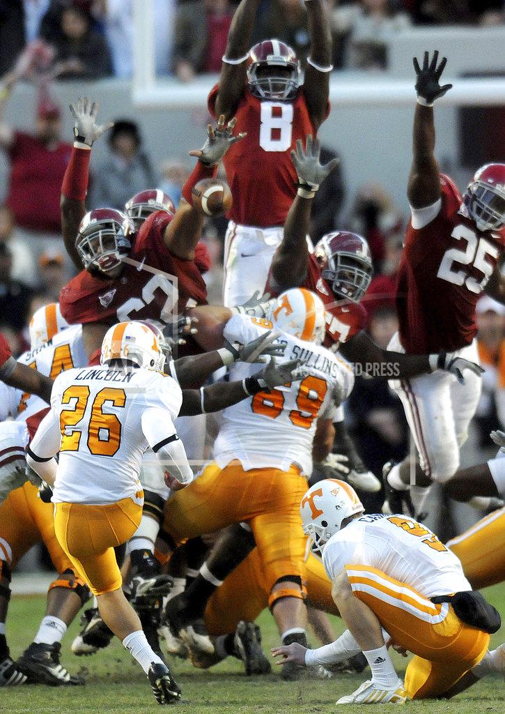 Mark Almond FILE - In this Oct. 24, 2009, file photo, Alabama defensive lineman Terrence Cody (62), left, blocks a field goal by Tennessee kicker Daniel Lincoln (26) in the closing seconds of the fourth quarter to clinch the Crimson Tide's 12-10 victory in an NCAA college football game at Bryant-Denny Stadium in Tuscaloosa, Ala. Alabama has beaten Tennessee each of the last 11 years by an average margin of 24.5 points. The only close calls during the streak came when Cody blocked a field goal as time expired to preserve a 12-10 triumph and when Derrick Henry’s go-ahead touchdown with 2:24 left gave the Tide a 19-14 victory in 2015. (Mark Almond/The Birmingham News via AP, File)