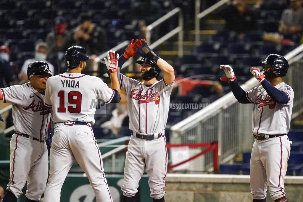 Alex Brandon Atlanta Braves' Huascar Ynoa celebrates his grand slam during the sixth inning of baseball game against the Washington Nationals at Nationals Park, Tuesday, May 4, 2021, in Washington. (AP Photo/Alex Brandon)